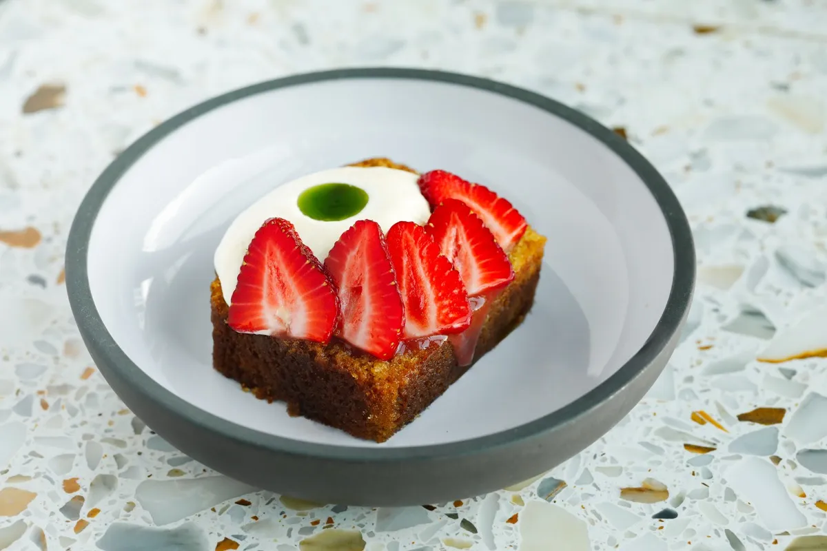 Olive oil cake with strawberries and cream