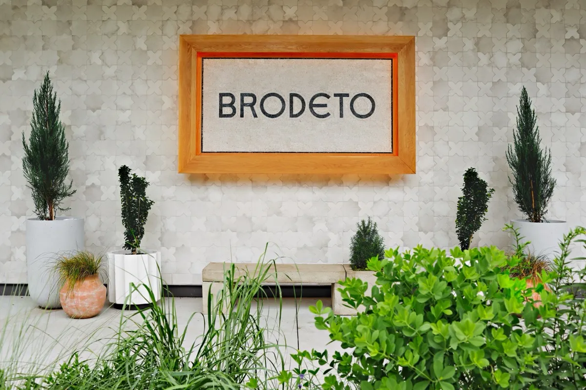 The Brodeto sign and patio greenery